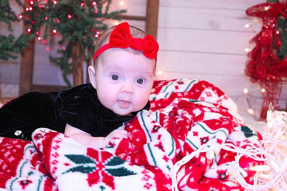 Morgan joined the competition — help win amazing prizes! baby, baby_toddler_clothing, carmine, christmas, christmas_decoration, christmas_eve, christmas_ornament, event, eye, fur, happy, hat, headwear, holiday, ornament, pattern, person, red, room, sleeve