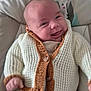 Alessandro participe au concours pour gagner de l'argent avec cette photo : baby, infant, smiling, knitted_cardigan, cozy, cute, cushion, chair, portrait, happy, child, warm_clothing, button, indoors, closeup, head, face, expression, seated, comfort