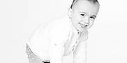 Pablo participe au concours pour gagner de l'argent avec cette photo : toddler, child, smiling, crawling, white_shirt, jeans, happy, portrait, studio, baby, cute, innocence, young_child, childhood, hands, kneeling, face, light_background, monochrome, black_and_white