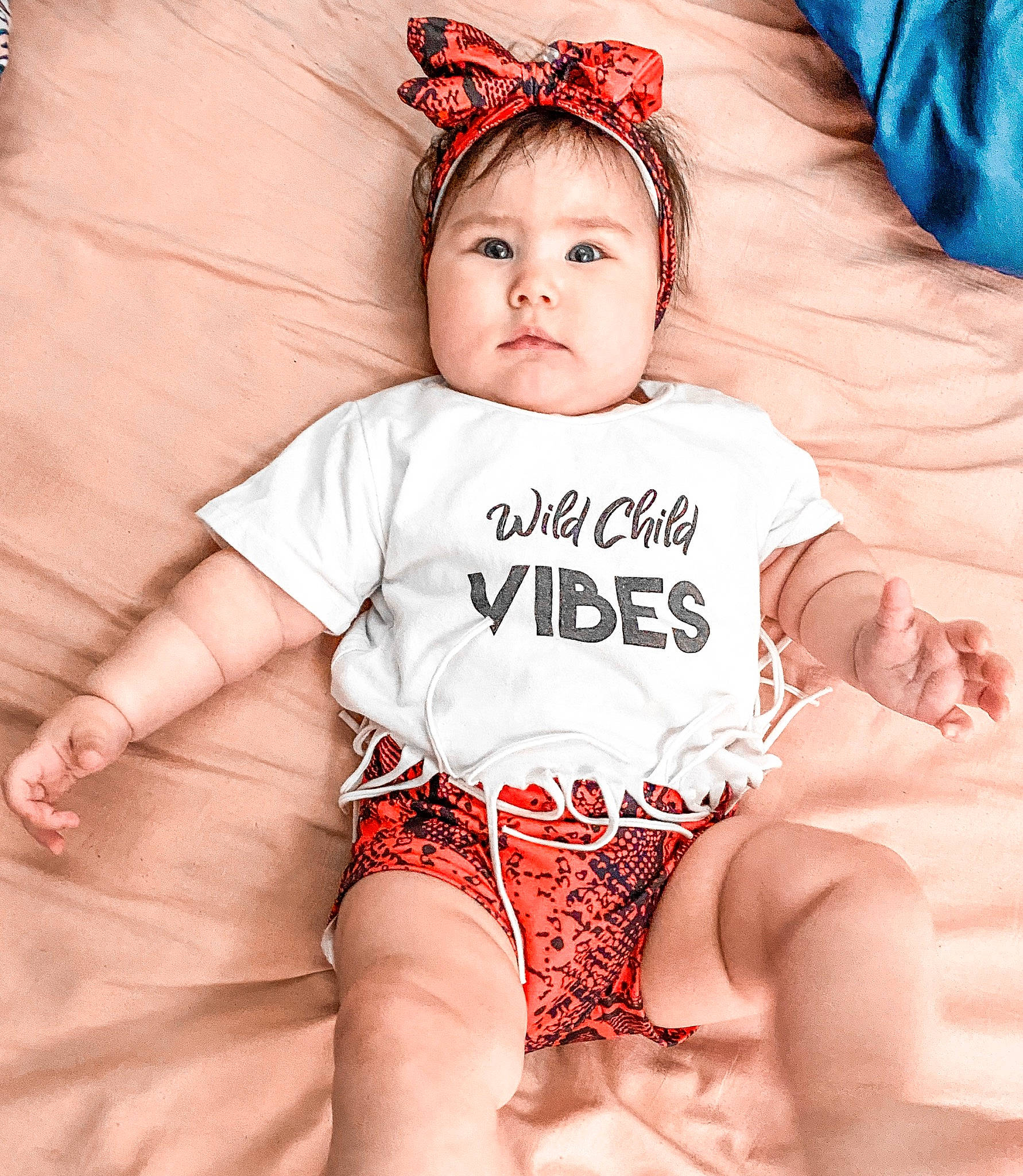 Julianna is registered to the contest to win money with this photo: baby, baby_toddler_clothing, blue, chest, child, eye, eyelash, face, finger, happy, head, leg, neck, organ, person, pink, skin, sleeve, stomach, textile