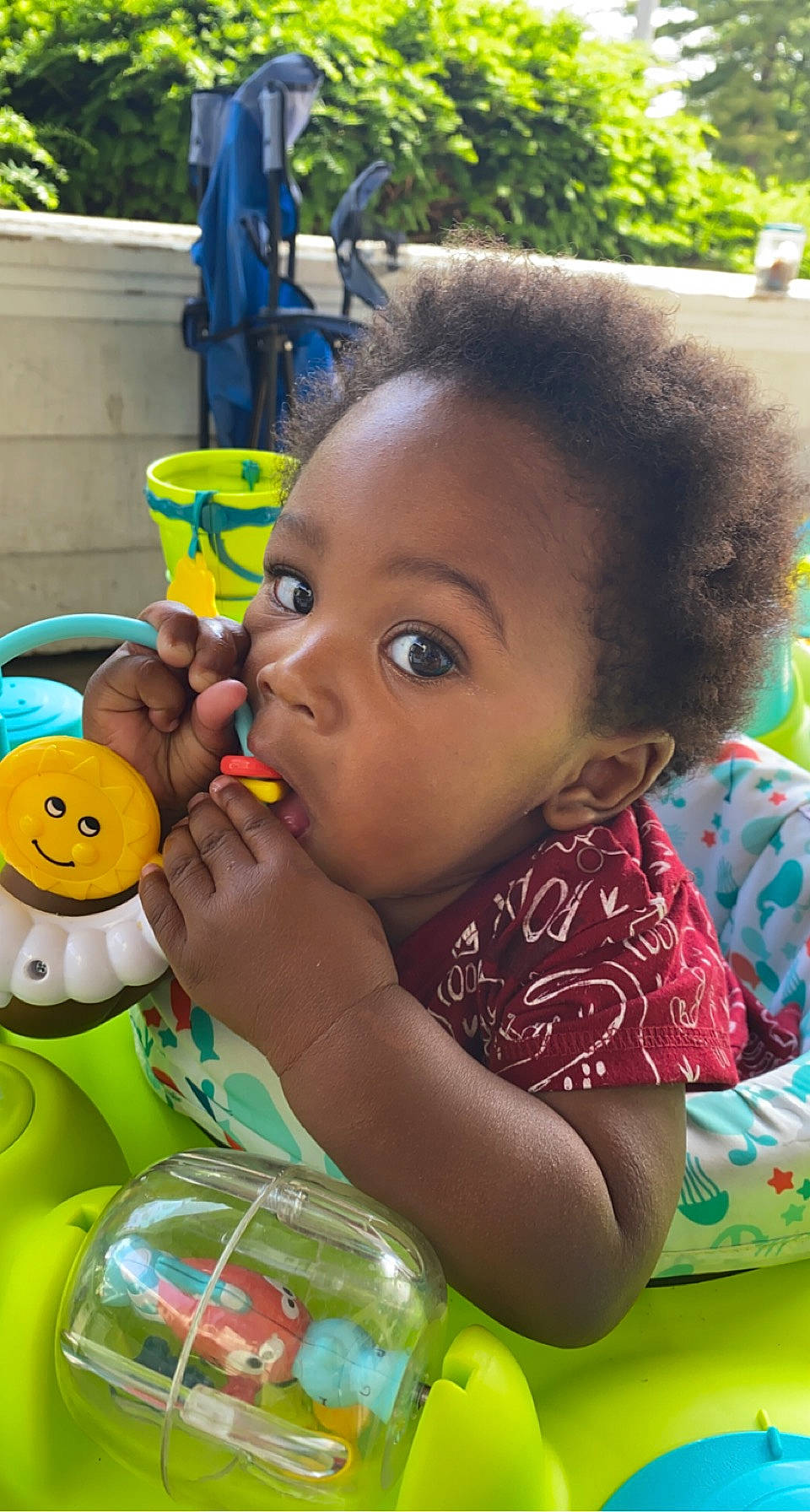 Egypt is registered to the contest to win money with this photo: adaptation, baby, cheek, child, facial_expression, fun, grass, green, hairstyle, happy, leisure, mouth, nose, person, play, skin, surprise, sweetness, toddler, toy