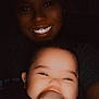 Tymeleanne is registered to the contest to win money with this photo: adult, affection, baby, child, closeup, cute, dark, expression, face, family, hand, happy, holding, infant, love, people, person, portrait, skin, smile