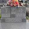 Mochi joined the competition — help win amazing prizes! dog, small_dog, pet, animal, cemetery, gravestone, headstone, memorial, flowers, bouquet, floral_arrangement, outdoor, grass, trees, rural, sky, religious_symbol, cross, photography, black_and_white_dog