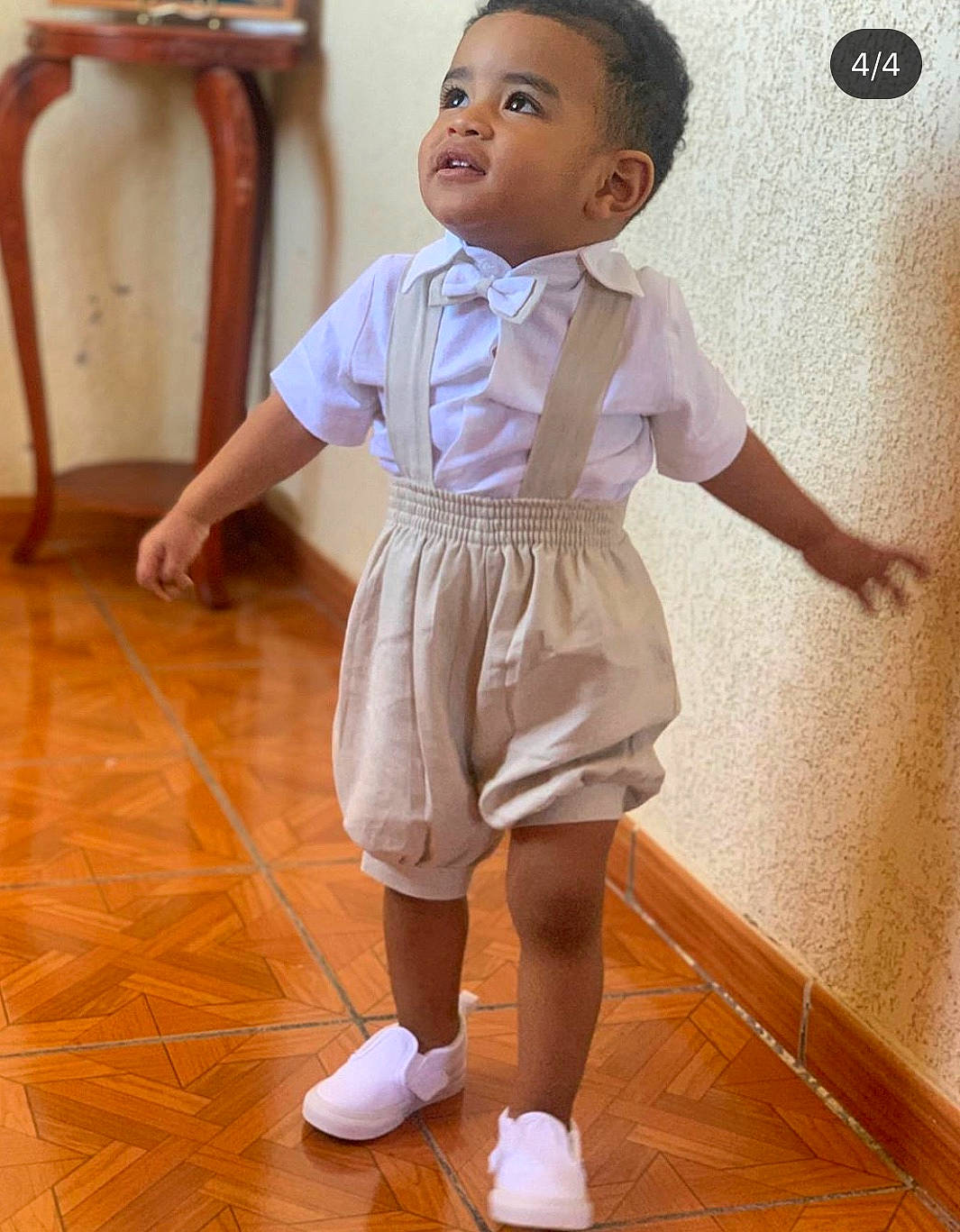 Gio is registered to the contest to win money with this photo: baby, child, dress, floor, flooring, footwear, joint, leg, person, play, room, shoe, shoulder, skin, standing, toddler