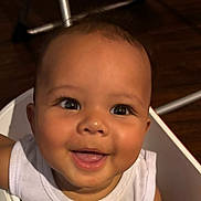 Justin joined the competition — help win amazing prizes! baby, smiling, face, child, infant, happy, person, white_clothing, sitting, chair, indoors, closeup, cute, young_child, portrait, expression, skin, head, eyes, mouth