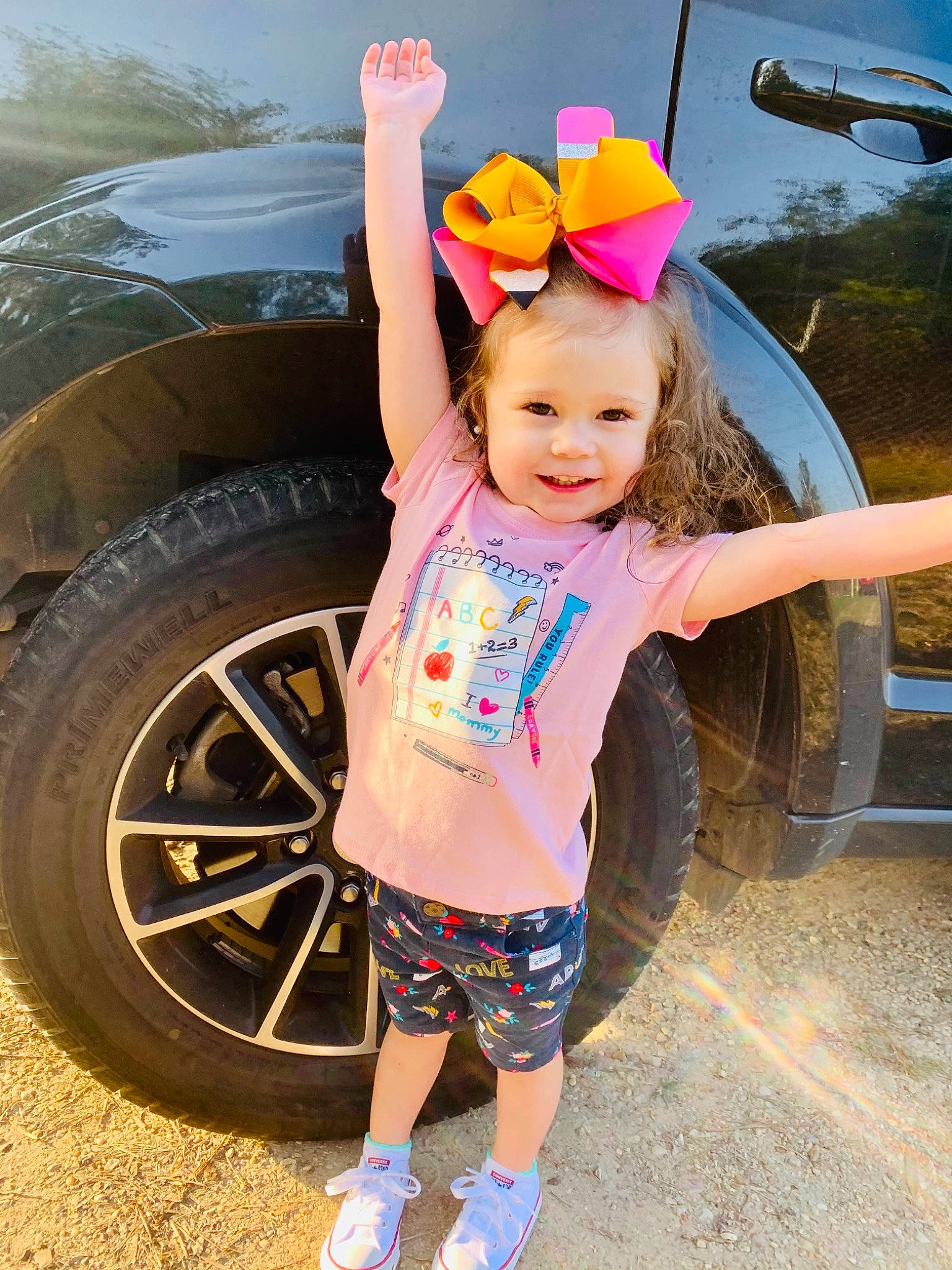 Jaylee is registered to the contest to win money with this photo: automotive_design, automotive_exterior, automotive_lighting, automotive_tire, bumper, car, eye, happy, hat, headgear, hood, jeans, joy, leg, motor_vehicle, person, pink, tire, vehicle, vehicle_door