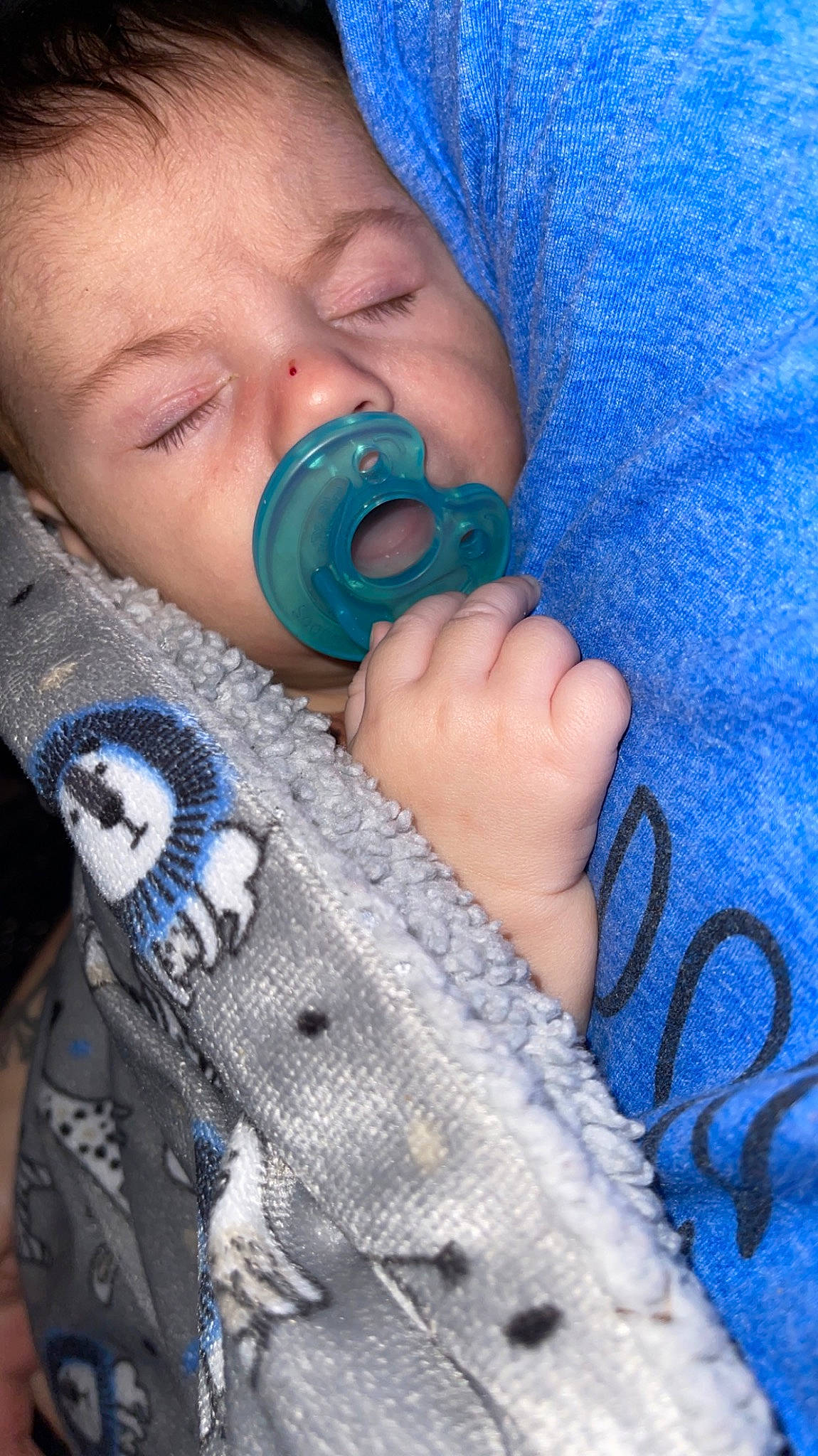 Grayson is registered to the contest to win money with this photo: azure, baby, baby_products, baby_toddler_clothing, blue, cheek, child, comfort, drinkware, electric_blue, eyelash, finger, gesture, nail, nose, pattern, person, skin, textile, thumb