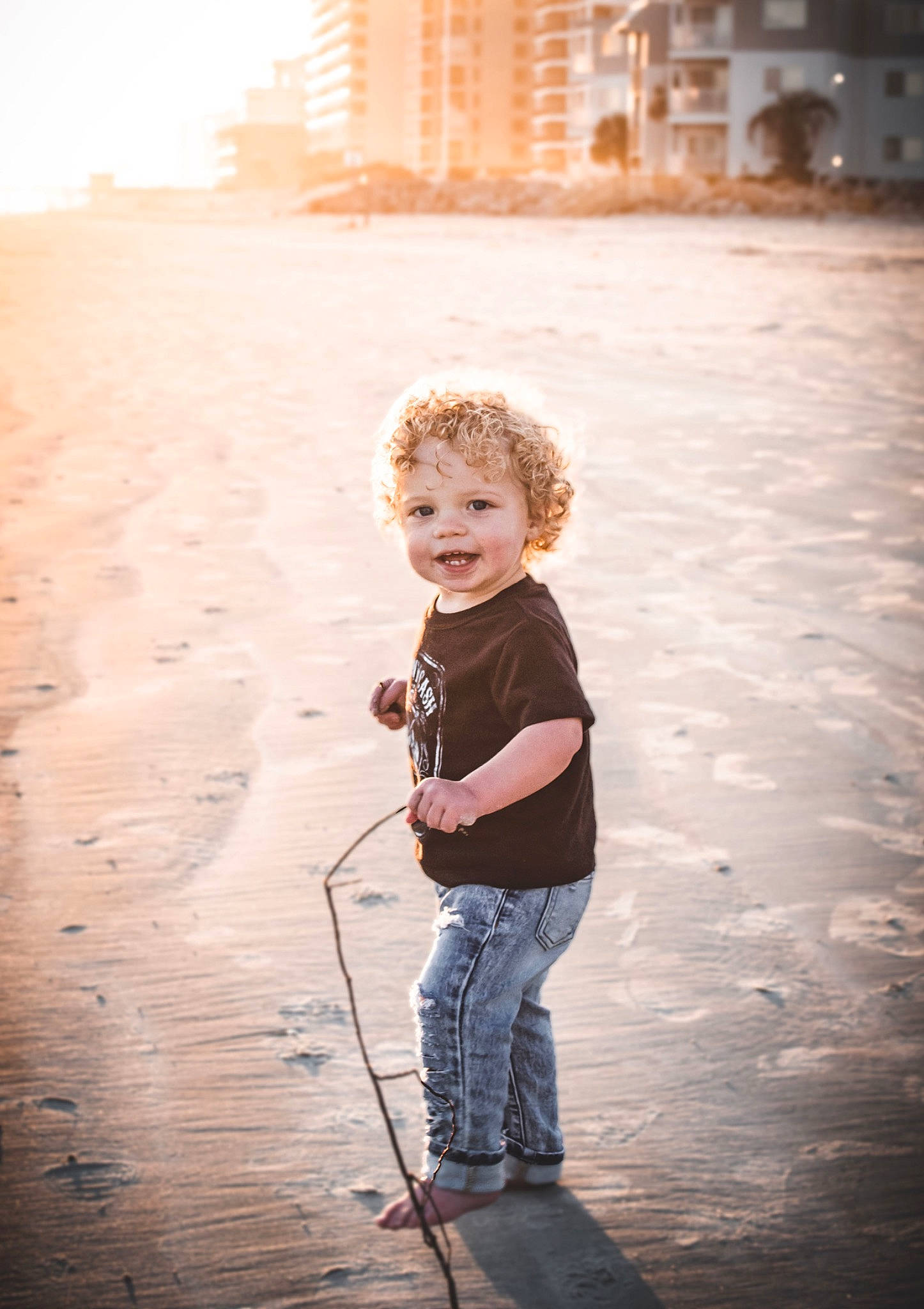 Lander is registered to the contest to win money with this photo: child, cloud, flash_photography, flooring, fun, happy, horizon, jeans, joy, landscape, ocean, people_in_nature, person, reflection, sand, shadow, sky, smile, standing, tints_and_shades