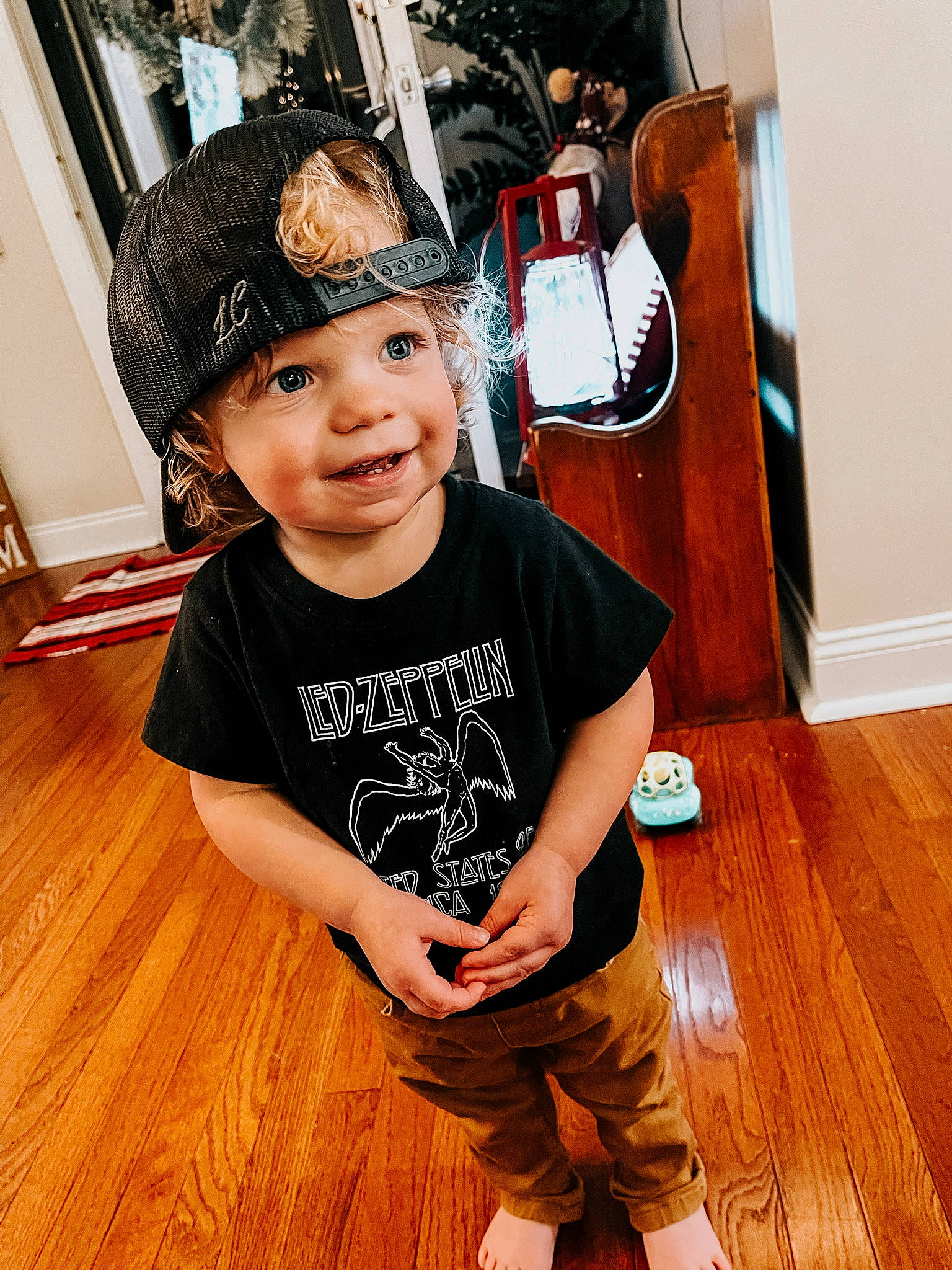 Lander joined the competition — help win amazing prizes! baby_toddler_clothing, bicycle_helmet, cap, flash_photography, floor, flooring, happy, hardwood, headwear, helmet, joy, laminate_flooring, person, personal_protective_equipment, sleeve, smile, sports_gear, t_shirt, toddler, varnish