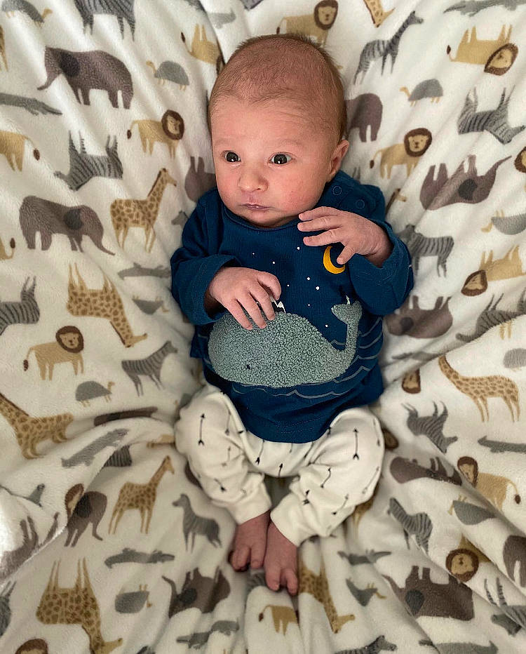 Benny is registered to the contest to win money with this photo: baby, baby_sleeping, cheek, child, linens, pattern, person, play, sitting, textile, toddler