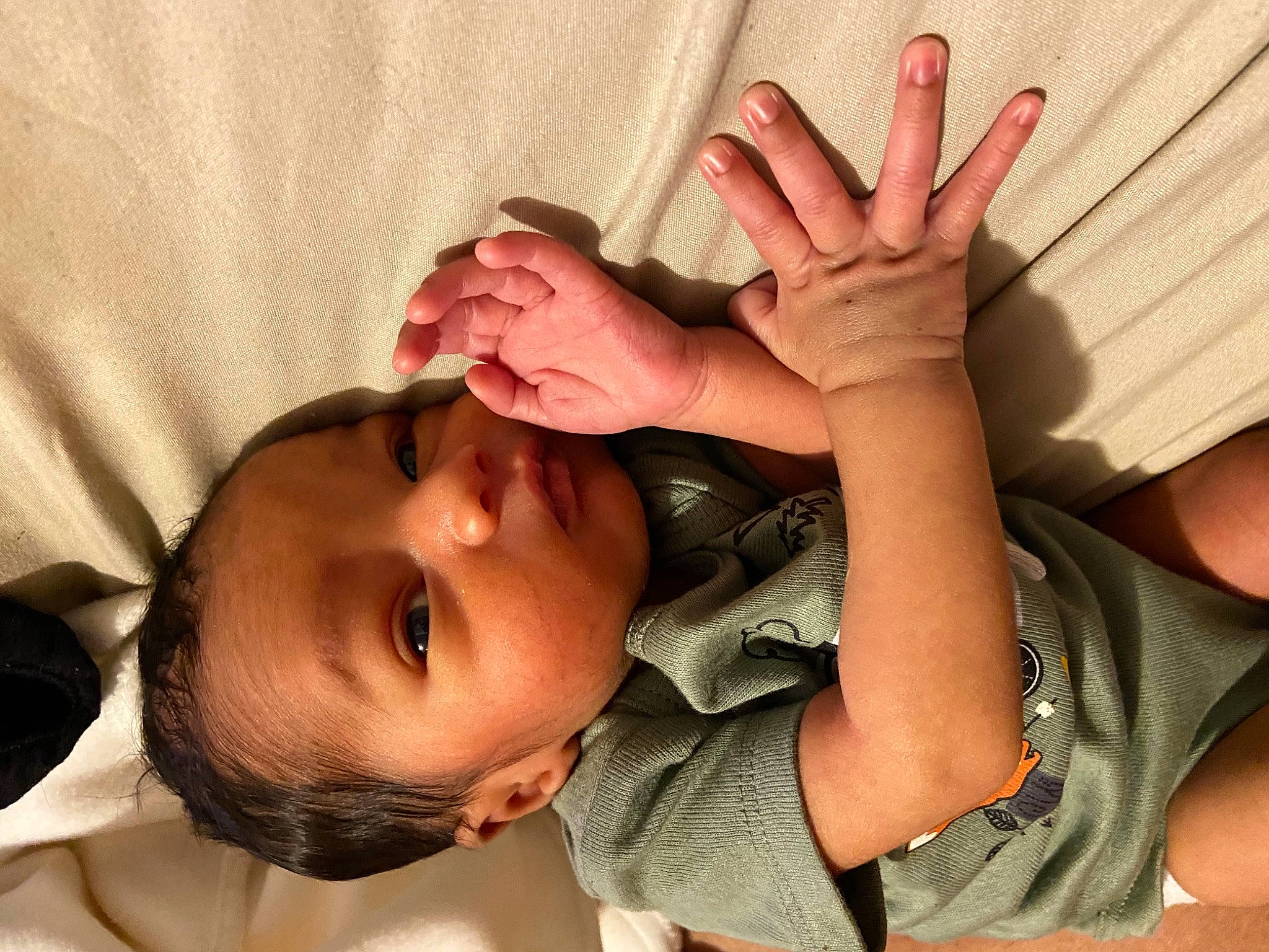 Major is registered to the contest to win money with this photo: arm, baby, baby_toddler_clothing, cheek, comfort, ear, eye, eyelash, finger, gesture, hand, happy, head, human_body, lip, mouth, nose, person, skin, sleeve