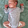 baby, newborn, sleeping, onesie, clothing, blanket, infant, peaceful, resting, cute, child, soft, fabric, skin, diaper, small_hands, small_feet, casual, indoor, portrait