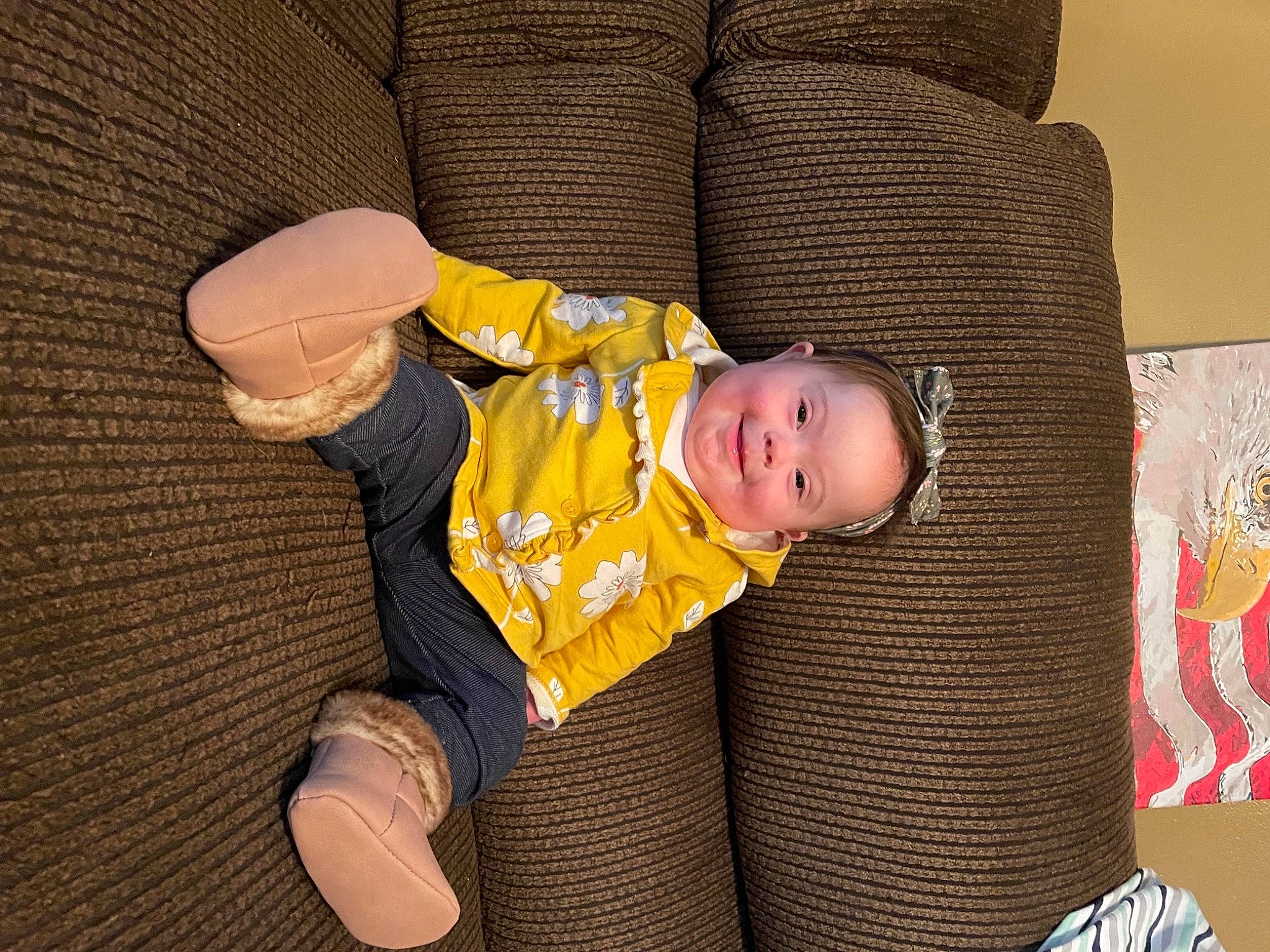 Adara is registered to the contest to win money with this photo: baby, baby_products, baby_toddler_clothing, cheek, child, comfort, couch, eye, face, finger, flooring, head, headgear, human_body, joy, linens, person, sitting, sleeve, toddler