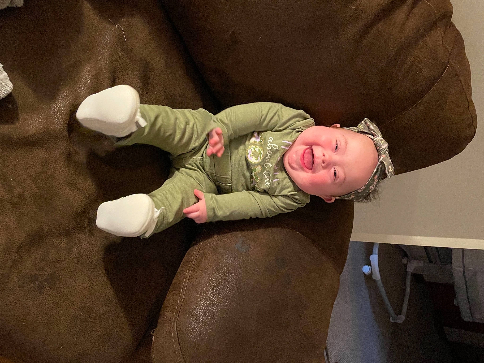 Adara is registered to the contest to win money with this photo: abdomen, baby, chest, comfort, elbow, eyewear, flash_photography, foot, glasses, hat, head, human_body, human_leg, knee, person, personal_protective_equipment, sitting, sleeve, smile, thigh