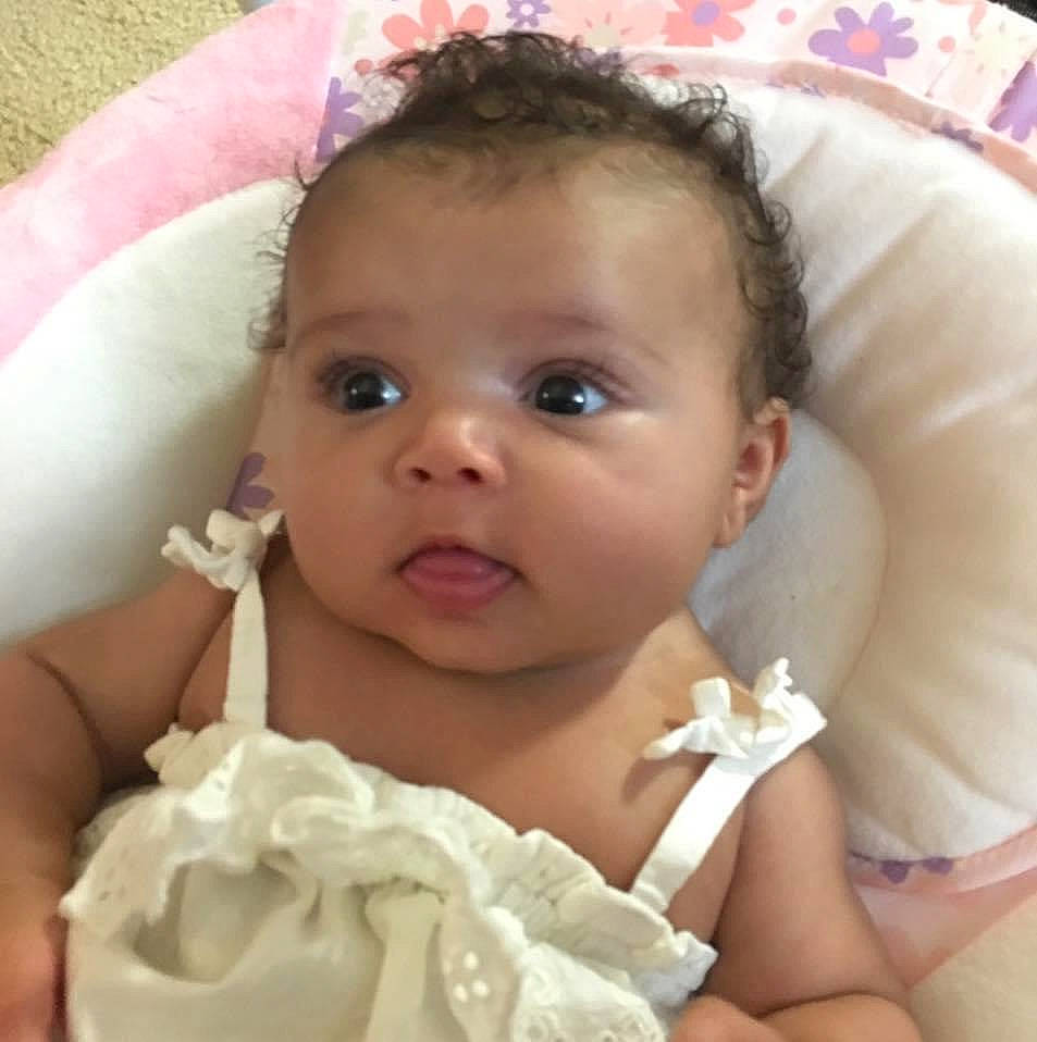 Nyala is registered to the contest to win money with this photo: baby, baby_products, cheek, child, ear, eye, face, hair_accessory, head, iris, lip, mouth, nose, person, pink, product, skin, smile, toddler