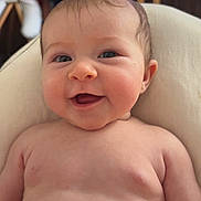 Ava a rejoint le concours — aidez-le/la à gagner de superbes lots ! baby, infant, smile, happy, face, blue_eyes, skin, chubby, cheeks, expression, cute, child, portrait, indoors, cushion, soft, relaxing, young, bare_chest, human