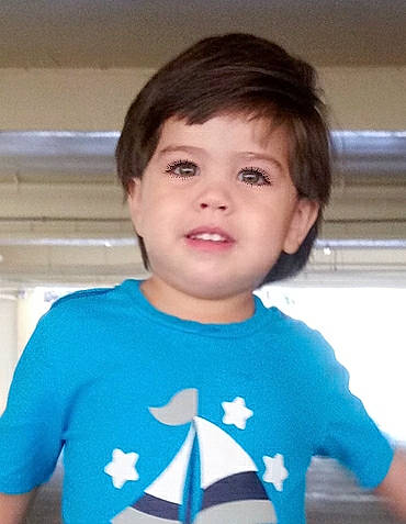 Jorge is registered to the contest to win money with this photo: baby, blue, cheek, child, child_model, chin, cool, face, forehead, hair, hairstyle, head, male, neck, person, skin, sleeve, smile, standing, t_shirt