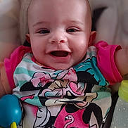 Lilou participe au concours pour gagner de l'argent avec cette photo : baby, child, smiling, face, toy, bottle, clothing, pink, blue, cartoon_character, minnie_mouse, happy, infant, closeup, cute, person, toddler, indoor, colorful, playful