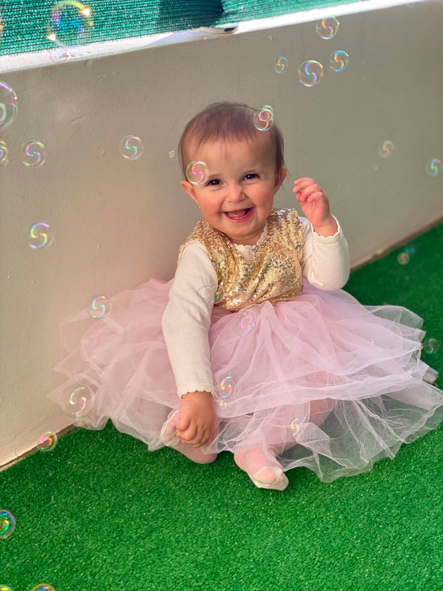 Ayla participe au concours pour gagner de l'argent avec cette photo : baby_toddler_clothing, child, dress, flash_photography, flooring, fun, grass, hair, happy, human_body, joy, leisure, magenta, pattern, people_in_nature, person, petal, pink, play, sitting