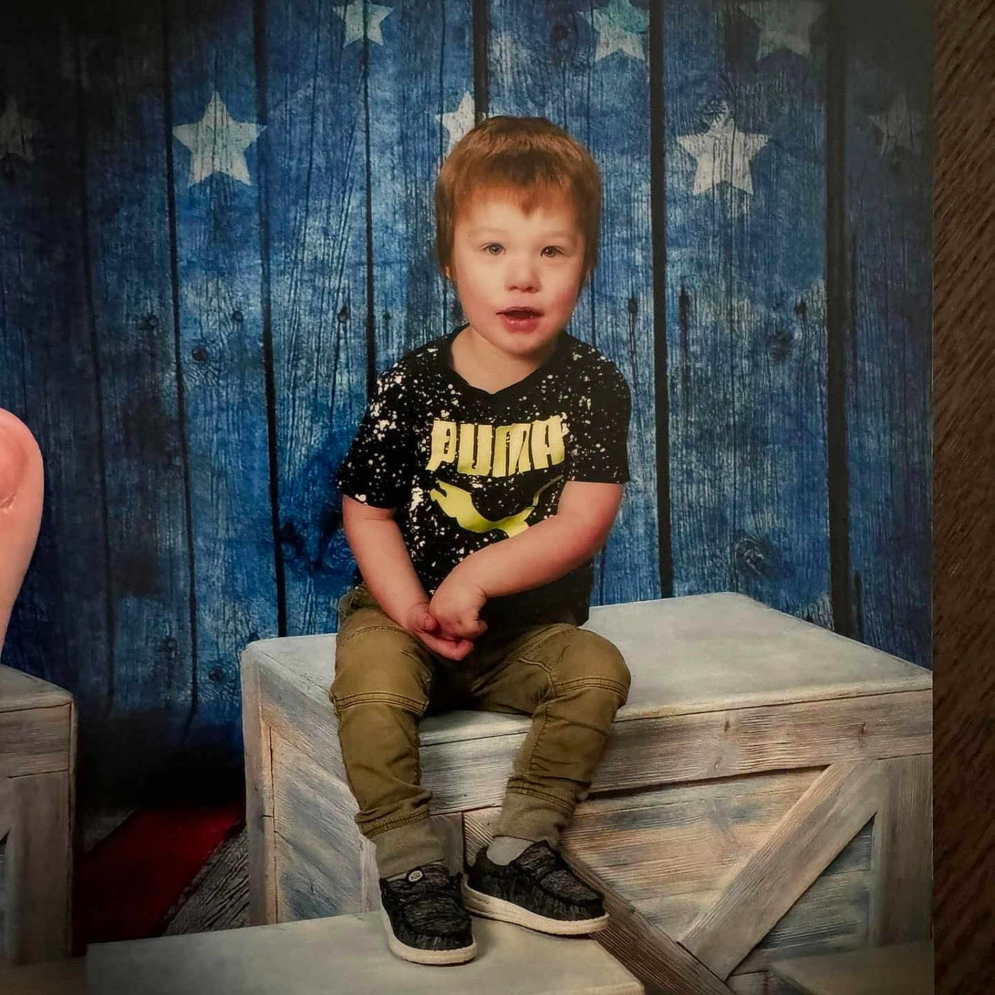 Tanner is registered to the contest to win money with this photo: boy, child, clothing, face, footwear, furniture, head, indoors, interiordesign, jeans, male, pants, person, photography, plywood, portrait, shoe, sitting, sleeve, wood