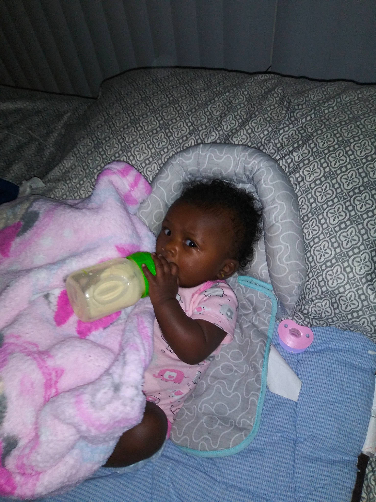 Melia is registered to the contest to win money with this photo: bedtime, cheek, child, day, eye, fun, girl, head, infant, leg, mouth, nose, person, pink, product, purple, sitting, skin, sleep, textile