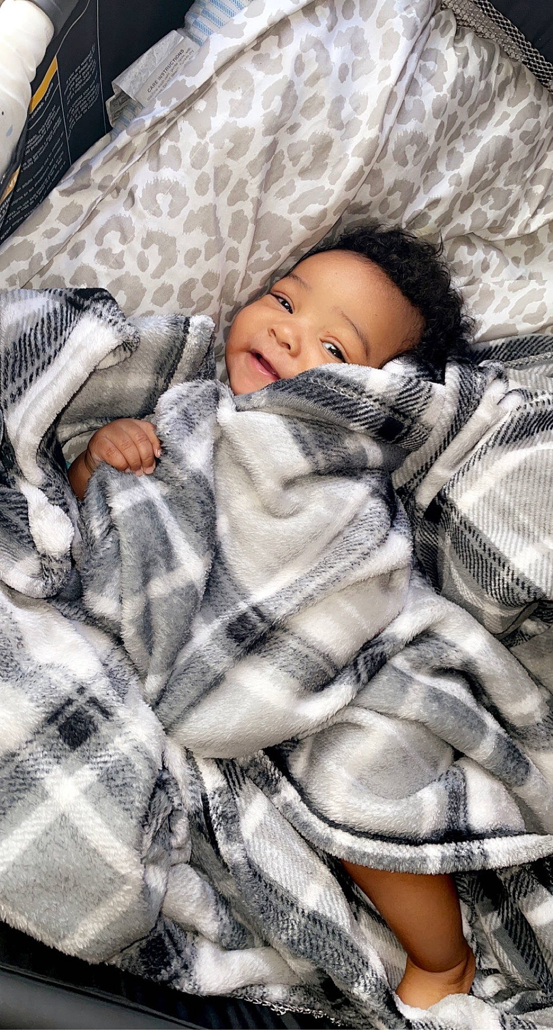 Raylen is registered to the contest to win money with this photo: baby, baby_products, baby_toddler_clothing, beauty, bedding, child, comfort, face, fur, linens, pattern, person, plaid, product, sleep, sleeve, smile, textile, toddler