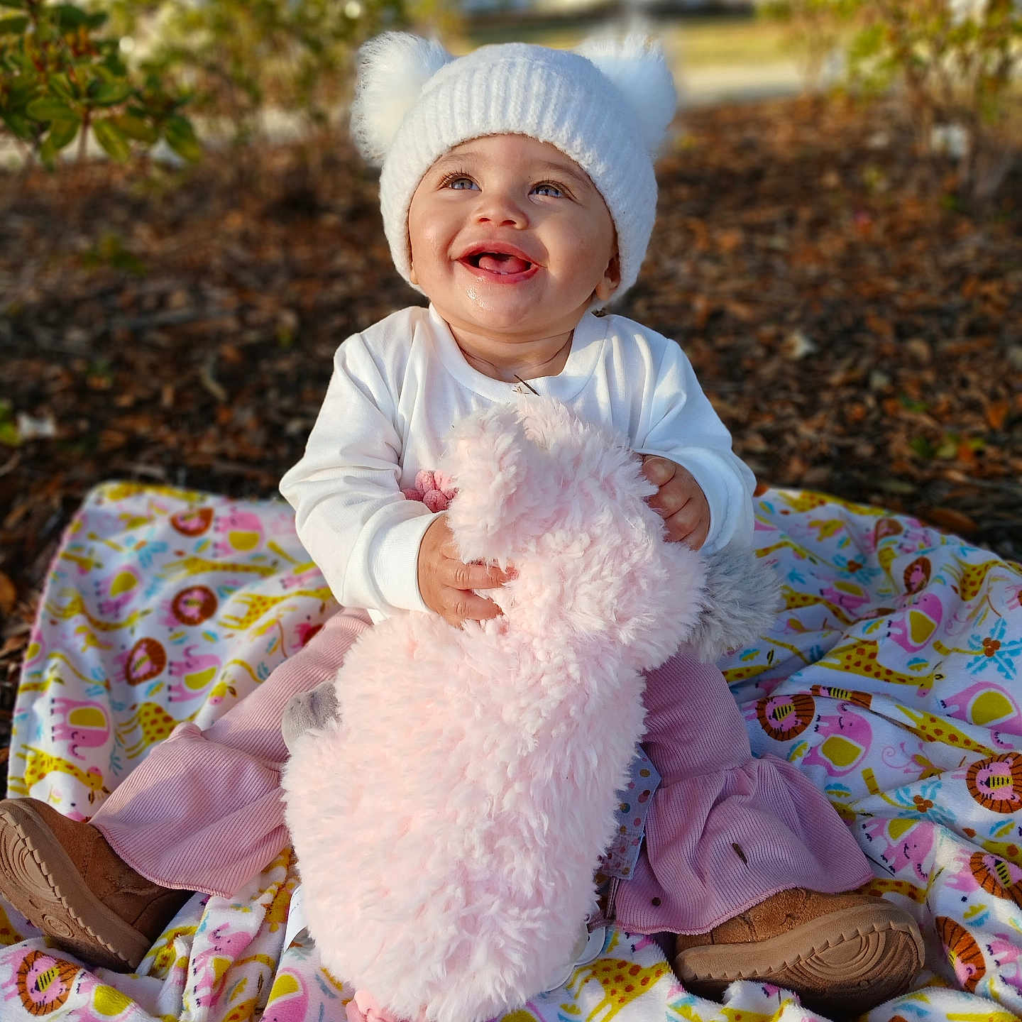 Sapphire joined the competition — help win amazing prizes! baby, bonnet, cap, clothing, dress, face, footwear, grass, happy, hat, head, laughing, person, photography, plant, portrait, shoe, sitting, smile, tree