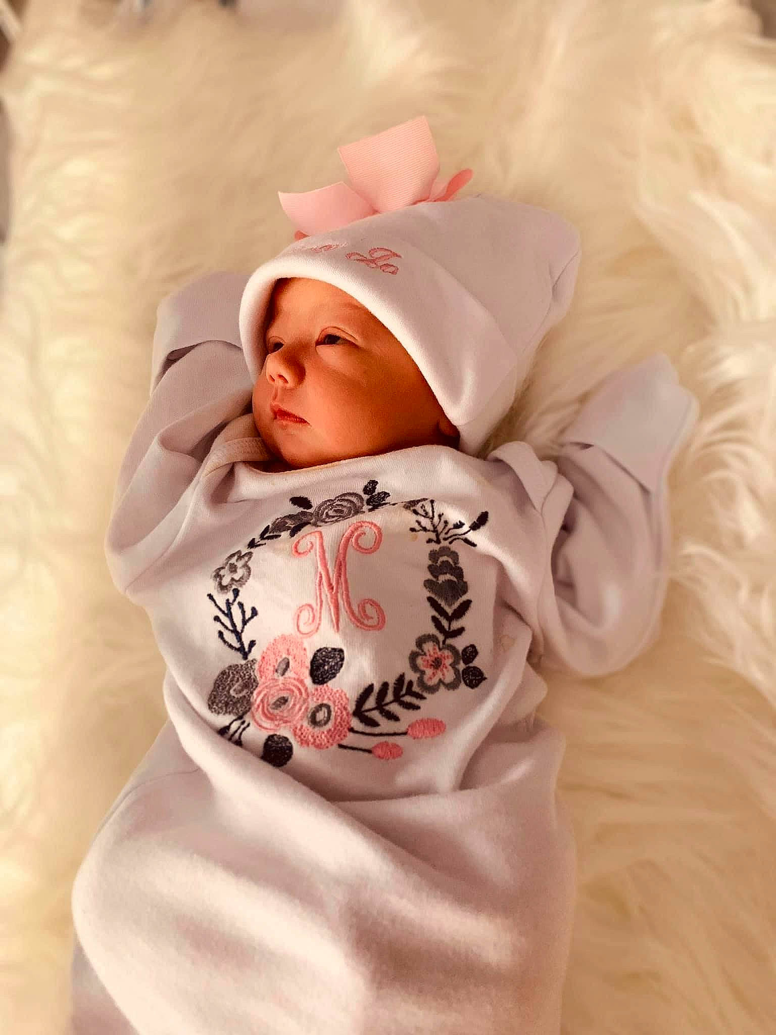 Macy is registered to the contest to win money with this photo: baby, baby_products, baby_sleeping, baby_toddler_clothing, bonnet, costume_accessory, fur, headwear, hood, hoodie, linens, peach, person, sleeve, toddler