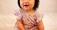 Kendall joined the competition — help win amazing prizes! baby, child, infant, smiling, pigtails, purple_bows, pink_dress, sitting, carpet, soft_texture, cute, happy, portrait, indoors, young_child, playful, adorable, face, hands, feet