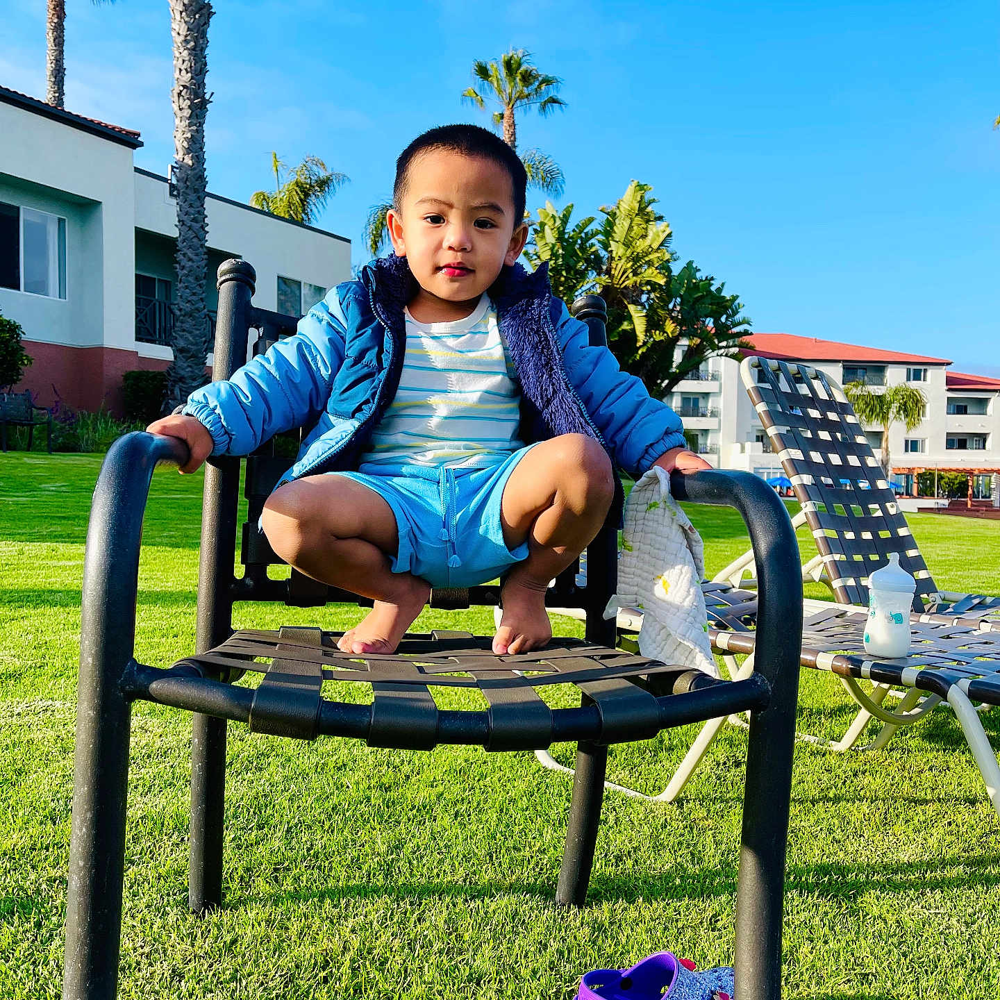 Zion Bryle is registered to the contest to win money with this photo: baby, backyard, clothing, face, footwear, grass, head, lawn, nature, outdoors, park, person, photography, plant, portrait, shoe, sitting, summer, tree, yard