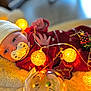 Jeanne participe au concours pour gagner de l'argent avec cette photo : baby, blanket, child, cute, decorative, festive, glowing_lights, hat, holiday, indoor, infant, knit_hat, pacifier, portrait, red_onesie, sleeping, soft_texture, string_lights, warm, yellow_lights