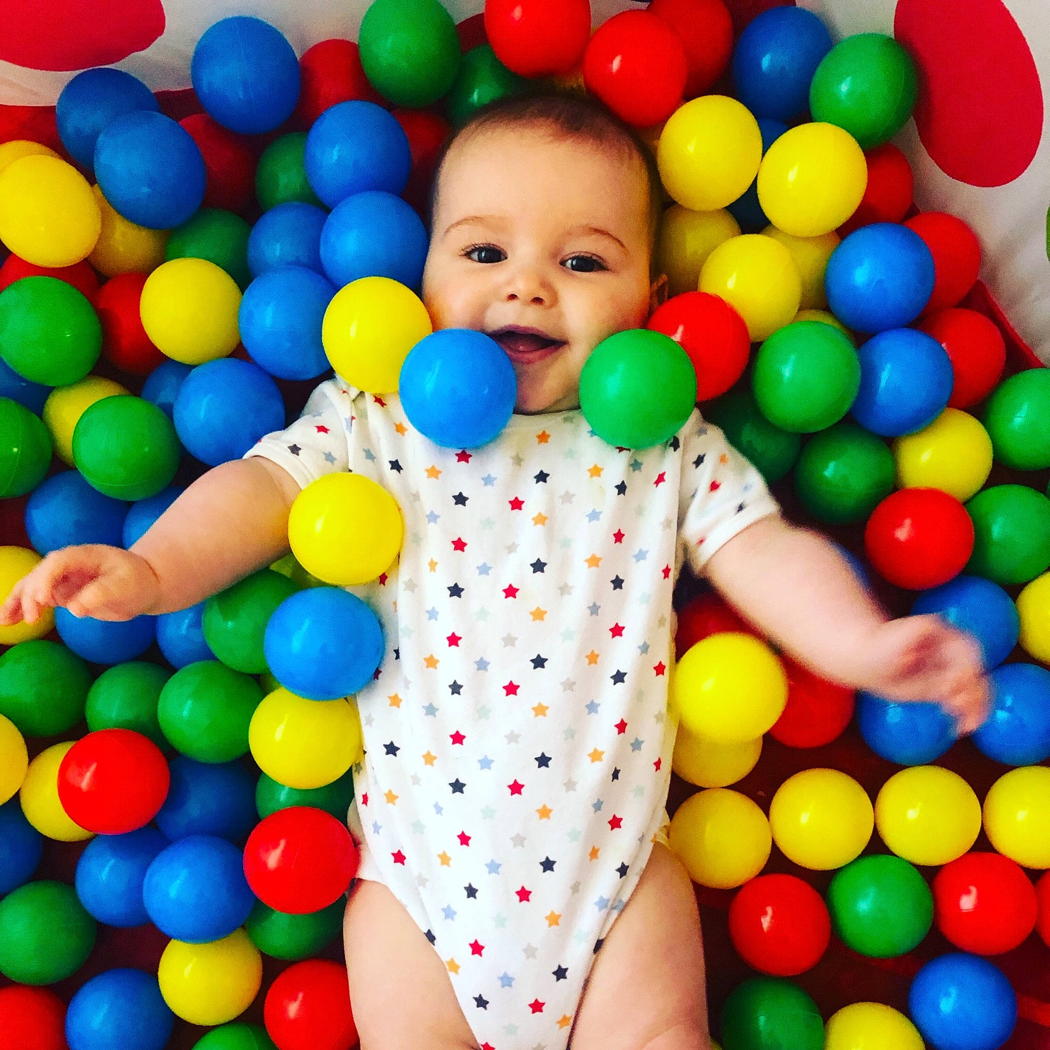 Gracie-may is registered to the contest to win money with this photo: baby_playing_with_toys, baby_toys, ball, ball_pit, balloon, child, party_supply, person, play, toddler, toy
