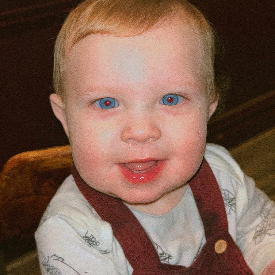 Pacey is registered to the contest to win money with this photo: baby, babylaughing, bodypart, clothing, couch, face, finger, furniture, hand, happy, head, laughing, mouth, pants, person, photography, portrait, sitting, smile, teeth