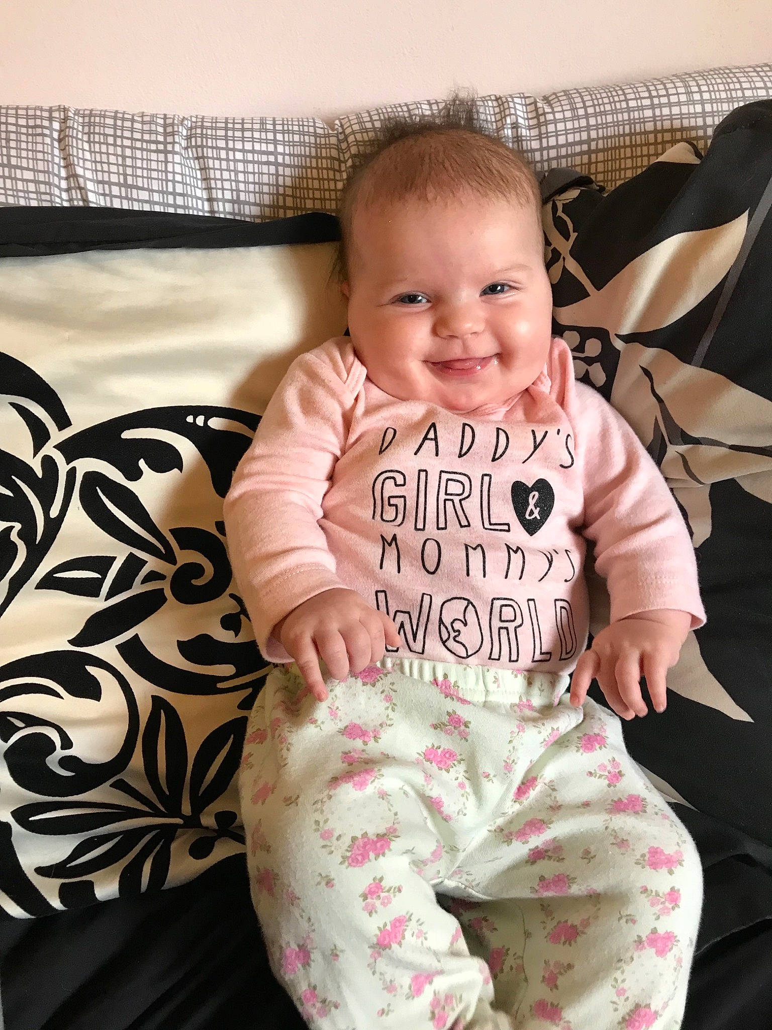 Lilyanna joined the competition — help win amazing prizes! baby, baby_products, baby_toddler_clothing, cheek, child, furniture, head, joy, pajamas, pattern, person, pink, product, room, sitting, skin, sleeve, smile, toddler