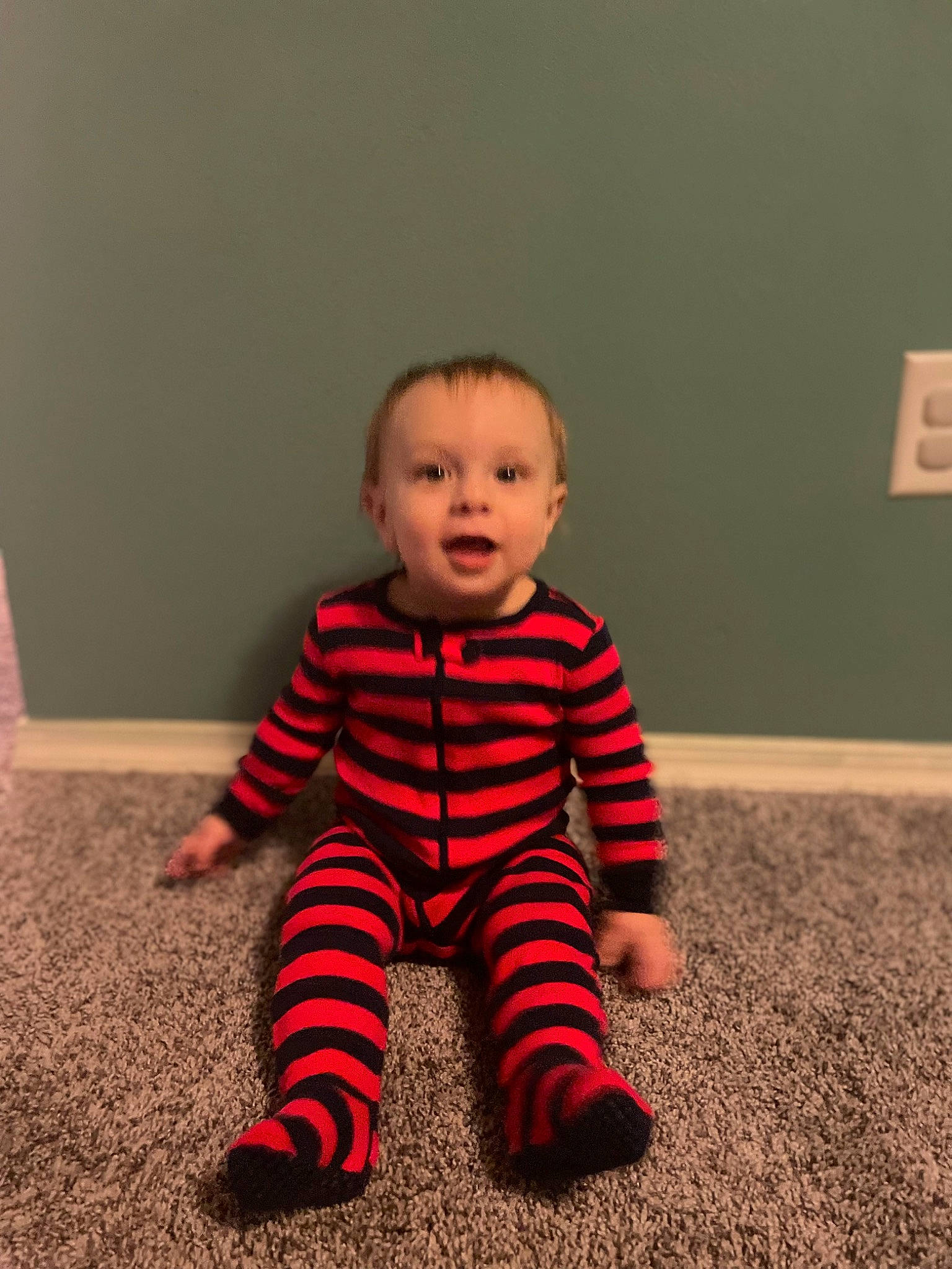 Felix joined the competition — help win amazing prizes! baby, baby_toddler_clothing, carmine, cheek, child, comfort, face, floor, flooring, foot, hardwood, human_leg, knee, pattern, person, sitting, sleeve, t_shirt, toddler, wood