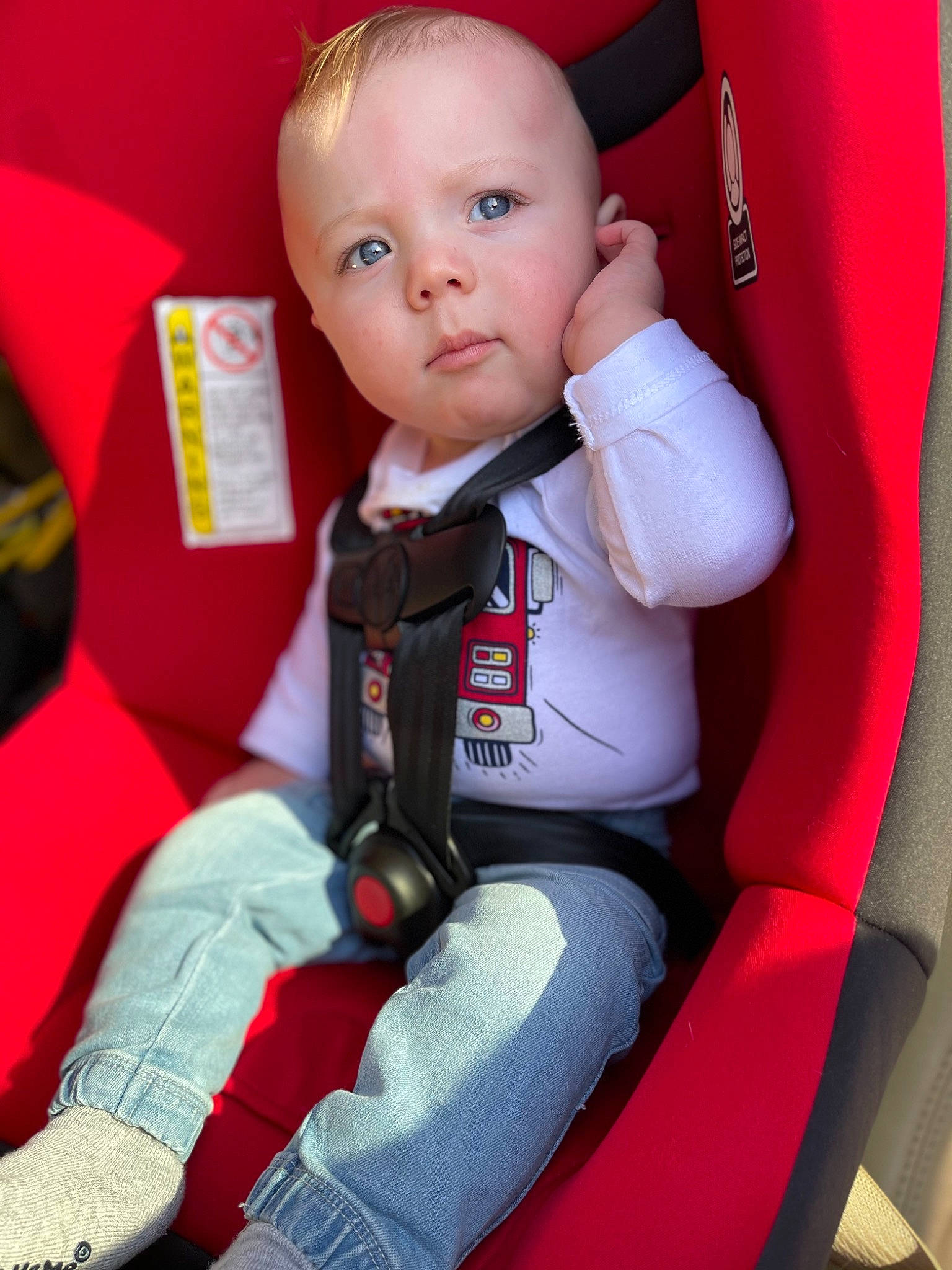 Benton is registered to the contest to win money with this photo: auto_part, baby, baby_products, baby_toddler_clothing, car_seat, car_seat_cover, carmine, child, collar, comfort, eye, formal_wear, fun, person, red, seat_belt, sitting, sleeve, suit, toddler