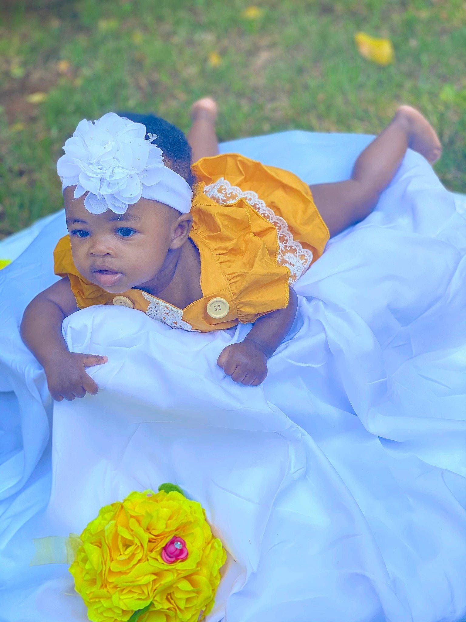 Denver joined the competition — help win amazing prizes! baby, child, dress, flower, hair_accessory, happy, headgear, headpiece, headwear, person, plant, smile, toddler, yellow