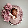 adorable, baby, basket, blanket, closeup, cozy, cute, flowers, headband, indoors, infant, knitted_toy, newborn, peaceful, pink, portrait, roses, sleeping, soft, wrapped