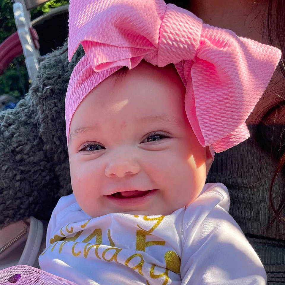 Isabella joined the competition — help win amazing prizes! baby, baby_toddler_clothing, cap, cheek, child, chin, cool, eye, eyelash, face, happy, head, headgear, headwear, lip, person, pink, product, purple, skin