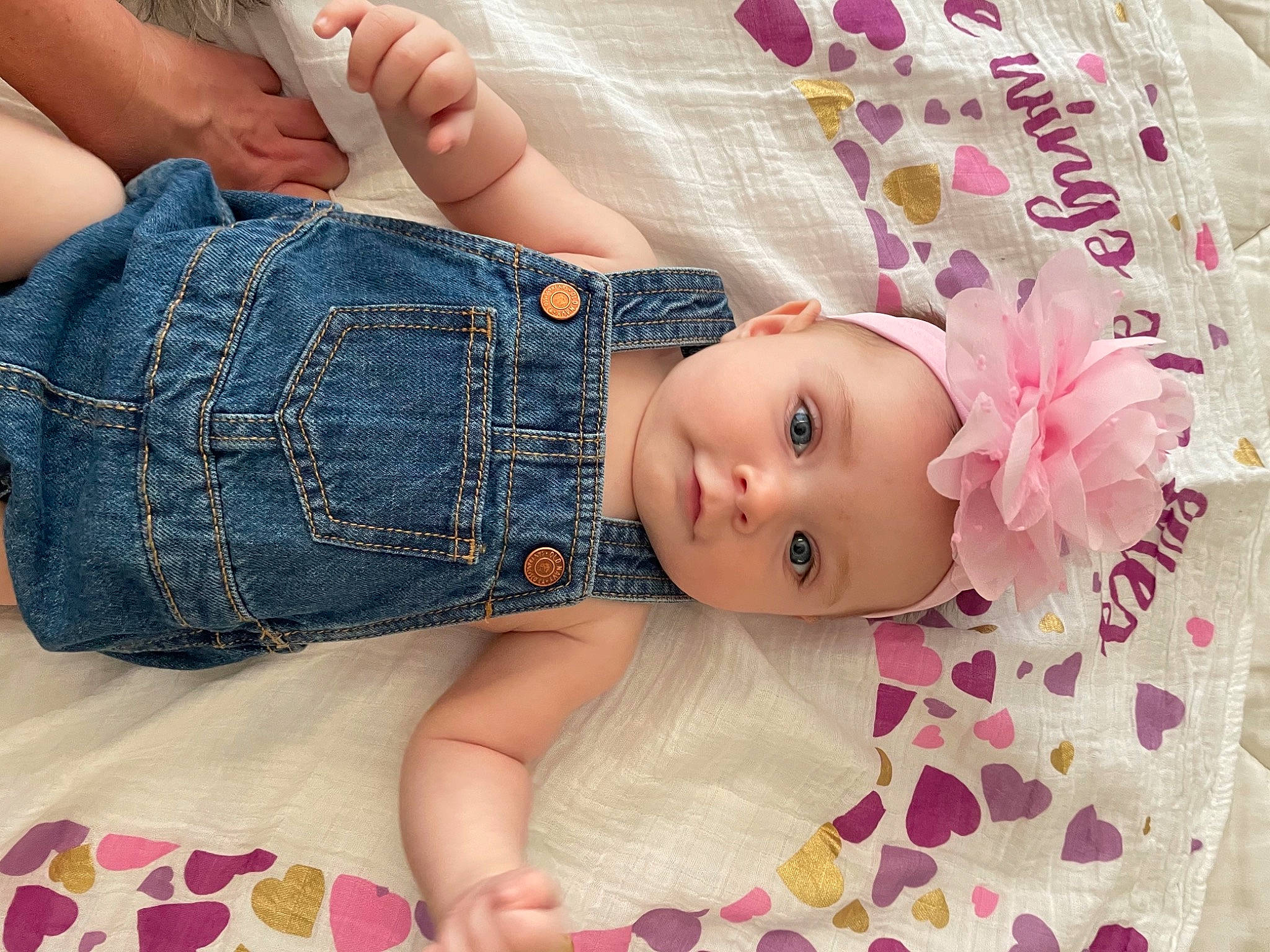 Isabella joined the competition — help win amazing prizes! abdomen, baby, baby_toddler_clothing, child, comfort, denim, foot, gesture, headwear, human_leg, jeans, knee, pattern, person, petal, pink, skin, sleeve, thigh, toddler