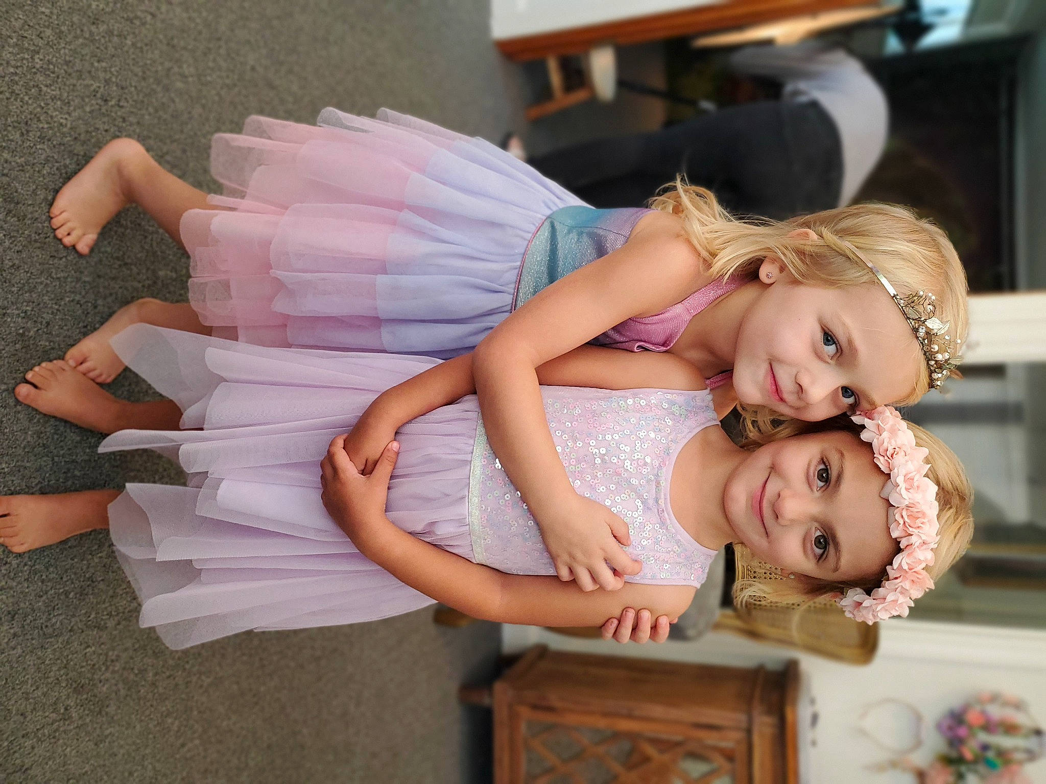 Isabelle is registered to the contest to win money with this photo: abdomen, child, dress, eyelash, flash_photography, fun, gesture, happy, headpiece, headwear, human_leg, jewellery, joy, necklace, person, pink, portrait_photography, room, sitting, skin