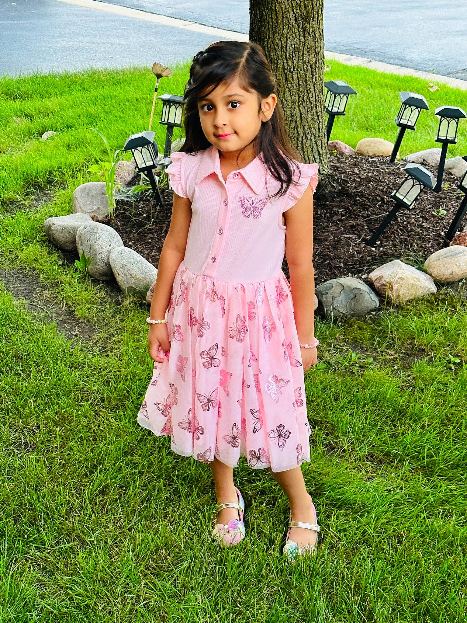 Eshaal joined the competition — help win amazing prizes! baby_toddler_clothing, child, day_dress, dress, fun, grass, grassland, green, happy, leisure, magenta, meadow, one_piece_garment, pattern, people_in_nature, person, plant, recreation, toddler, tree