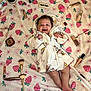 Yma Isabell is registered to the contest to win money with this photo: baby, infant, robe, blanket, strawberry_pattern, makeup, cosmetics, brush, eyelash_curler, lipstick, concealer, foundation, powder, face, smiling, happy, lying_down, cute, child, indoor