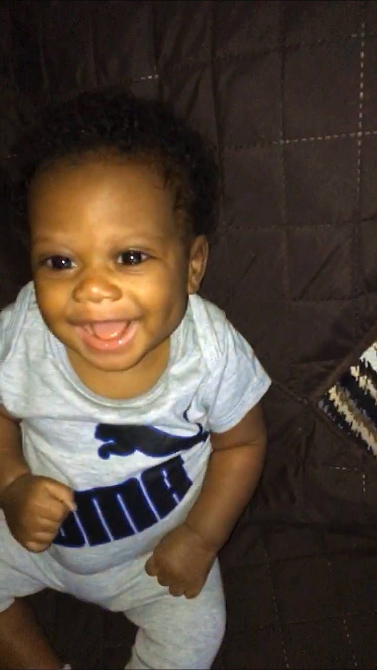 Khamari is registered to the contest to win money with this photo: baby, black_hair, cheek, child, chin, cool, eye, eyebrow, face, facial_expression, forehead, fun, hair, hairstyle, head, joy, lip, nose, person, skin