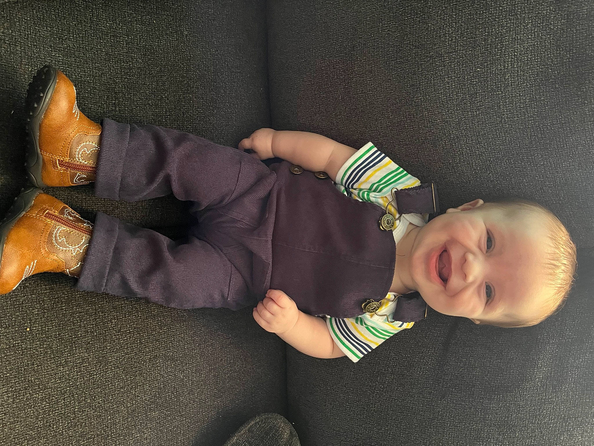 Maverick is registered to the contest to win money with this photo: arm, baby, baby_toddler_clothing, comfort, couch, finger, foot, glasses, hand, human_leg, joy, knee, leg, person, sleeve, sock, studio_couch, textile, thigh, toddler