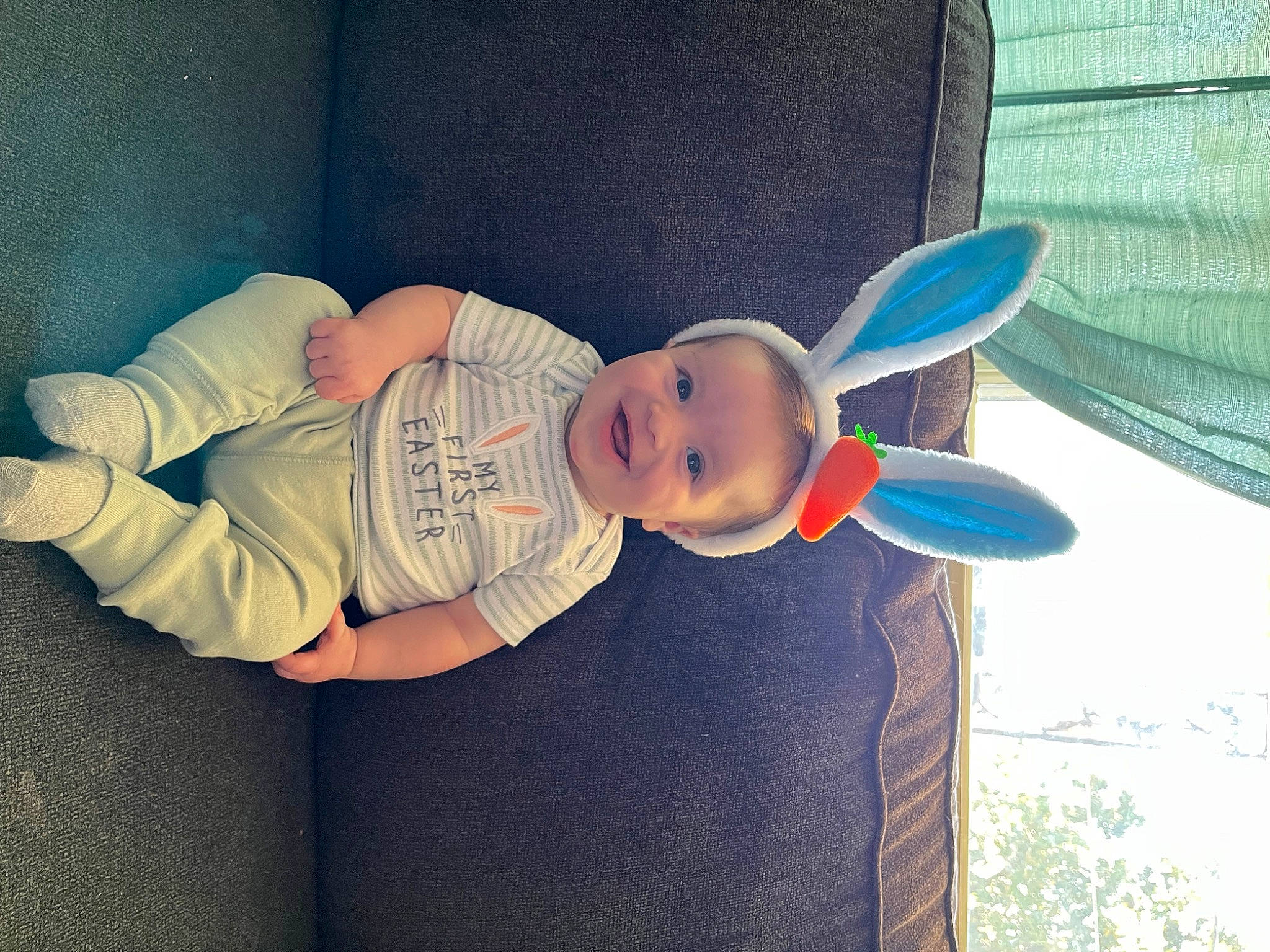 Maverick is registered to the contest to win money with this photo: baby, baby_products, baby_toddler_clothing, child, comfort, cool, face, finger, fun, hand, happy, hat, headgear, human_body, joy, leg, person, sleeve, smile, t_shirt