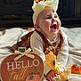 Riley is registered to the contest to win money with this photo: autumn, baby, blanket, bow, celebration, child, clothing, cozy, cute, decor, fall, fireplace, happy, headband, indoor, portrait, pumpkin, seasonal, smiling, sunflower