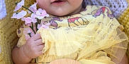 Riley joined the competition — help win amazing prizes! accessories, baby, bonnet, cap, clothing, costume, dress, face, flower, flowerarrangement, hat, head, newborn, person, petal, photography, plant, portrait, purple, sitting