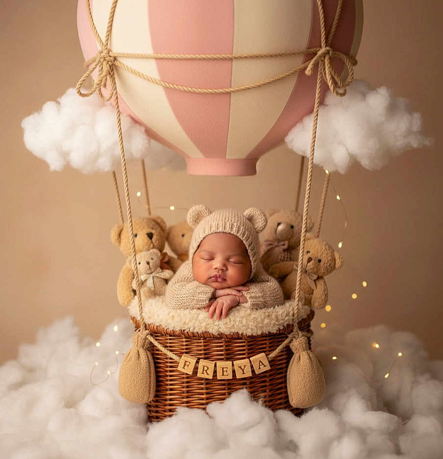 Freya joined the competition — help win amazing prizes! baby, sleeping, knitted_hat, bear_ears, teddy_bears, hot_air_balloon, basket, clouds, soft_lighting, cozy, cute, infant, portrait, props, decorative_lights, woven_basket, child, newborn, studio_photo, neutral_background