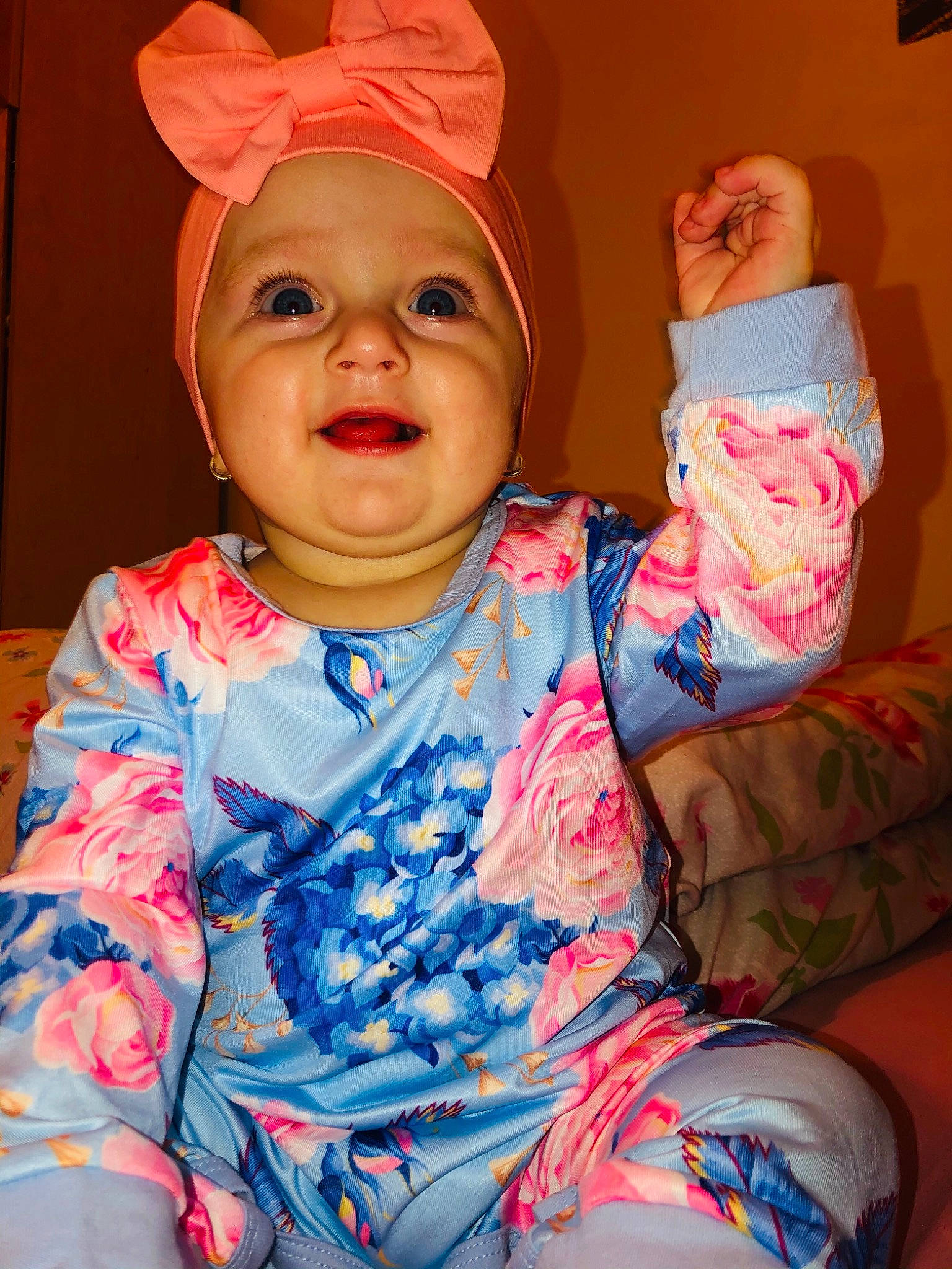 Beatrice is registered to the contest to win money with this photo: baby, cheek, child, ear, fashion_accessory, happy, headgear, headwear, person, pink, smile, textile, toddler